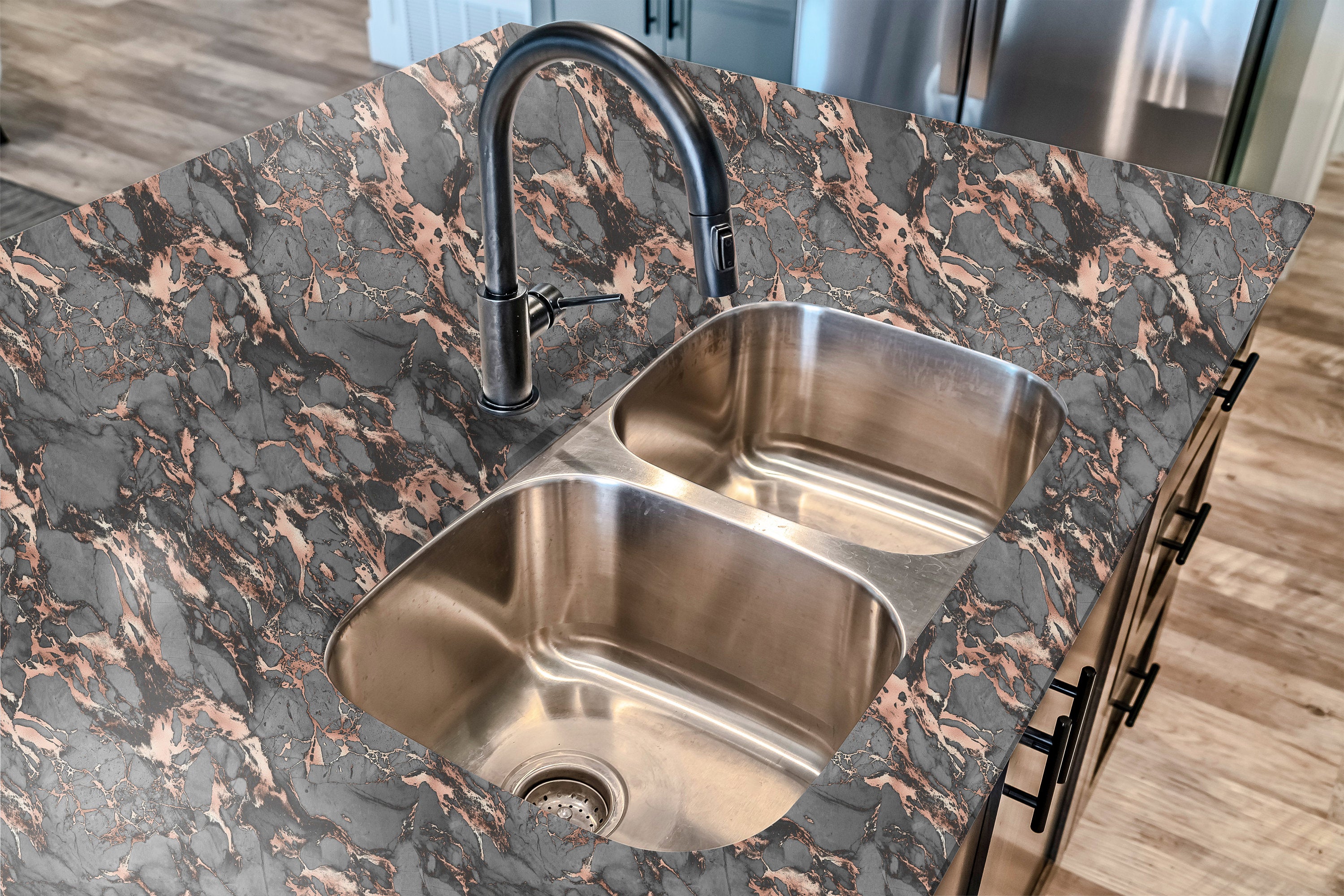 Countertop 10: Close-up view of a luxurious black and gold marble peel-and-stick paper applied to a modern kitchen countertop. Featuring realistic stone textures and an elegant high-gloss finish.