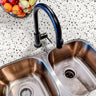 Countertop 21: A modern kitchen countertop covered in white terrazzo-patterned film with gray and neutral speckles, creating a minimalist and contemporary look.