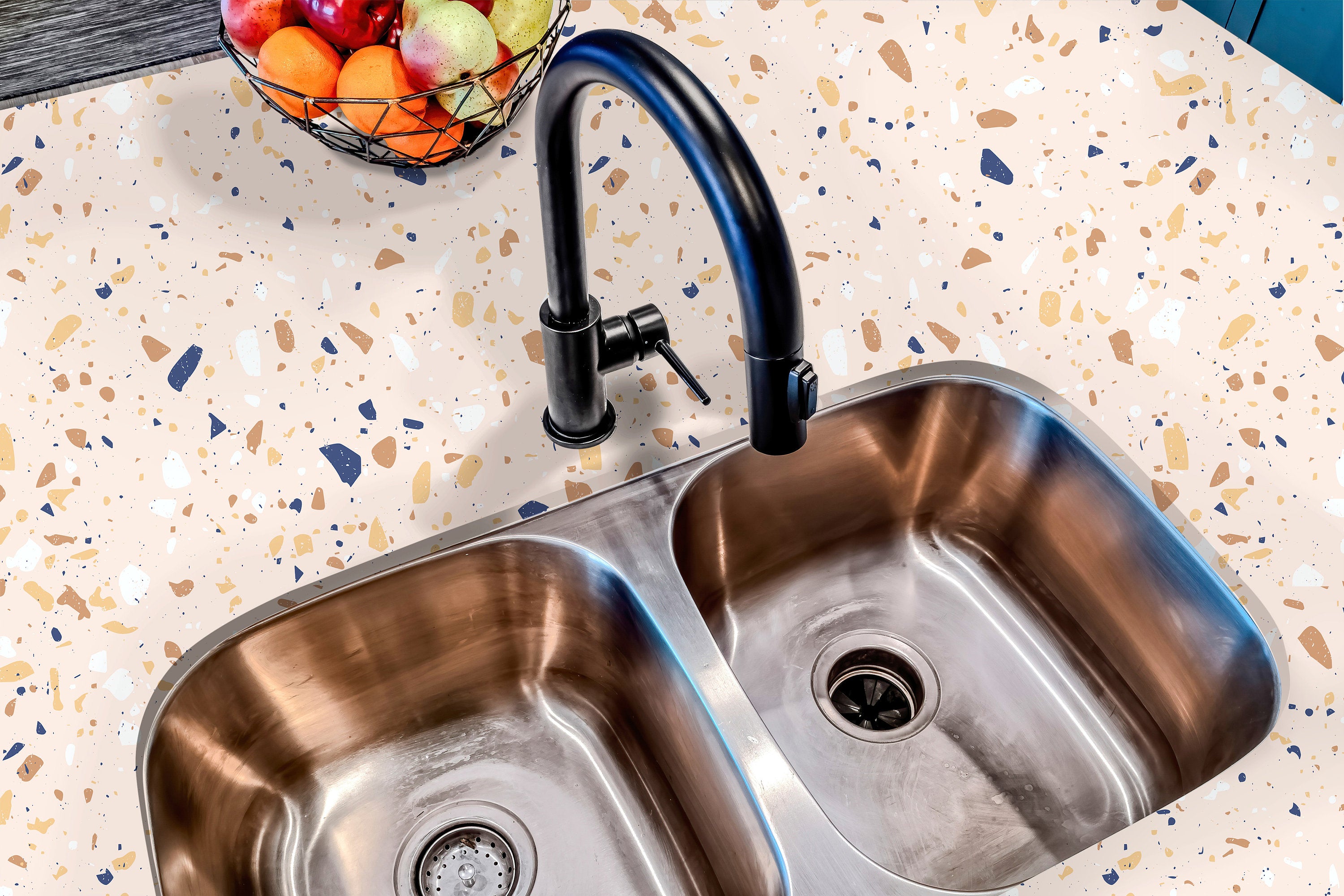 Countertop 26: A modern kitchen countertop covered in beige and navy terrazzo-patterned film, featuring warm earth tones and navy blue speckles for a stylish and contemporary look.