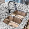 Countertop 13: Snowfall Granite peel-and-stick countertop wrap with a realistic white and black speckled stone design, ideal for modern kitchen updates.
