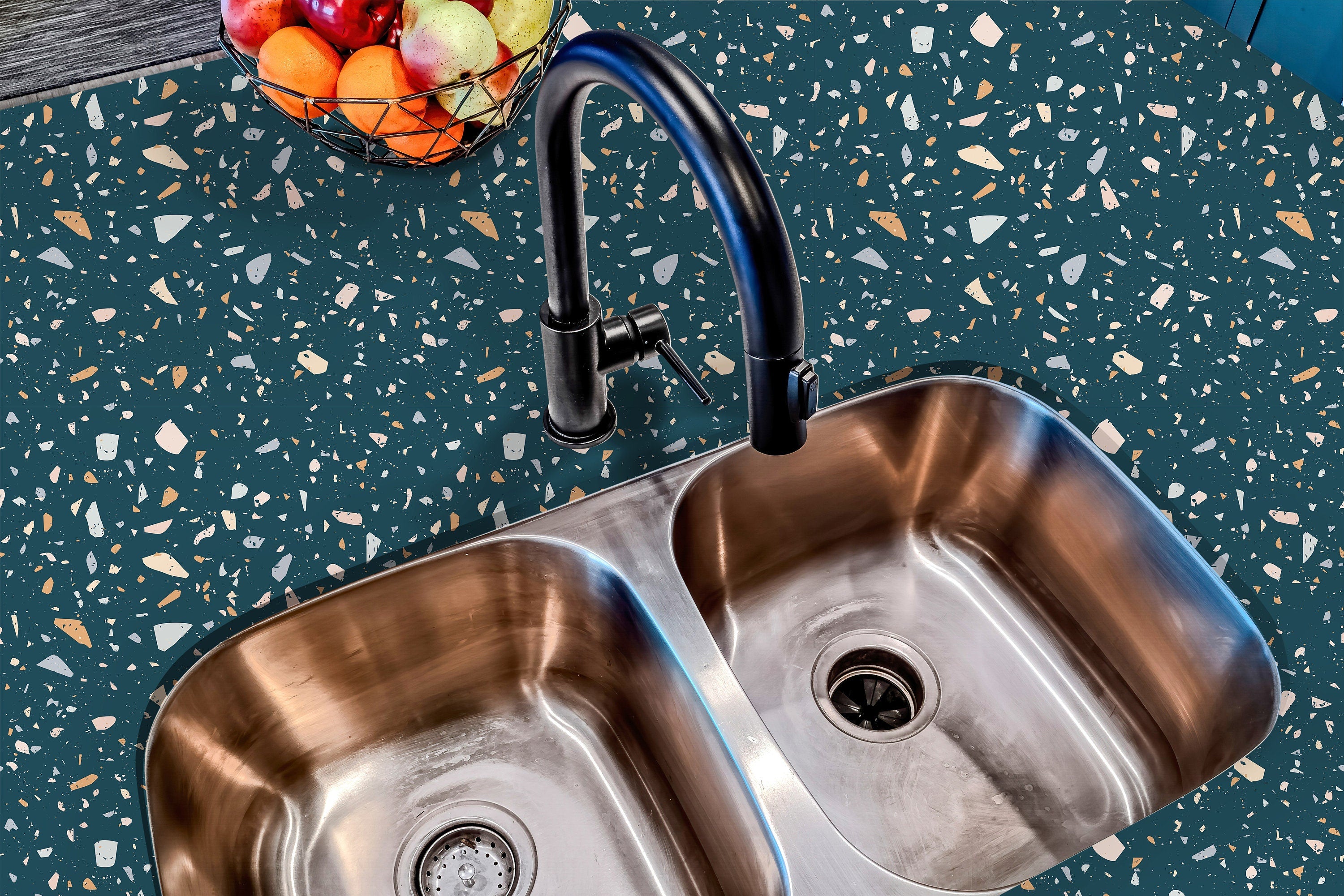 Countertop 28: A modern kitchen countertop covered in turquoise terrazzo-patterned film with multi-colored speckles, offering a stylish and contemporary aesthetic.