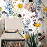 Wallpaper 3778: A vibrant floral wallpaper featuring hand-painted wildflowers in shades of yellow, blue, red, and green on a soft white background, creating a bold and artistic botanical aesthetic.