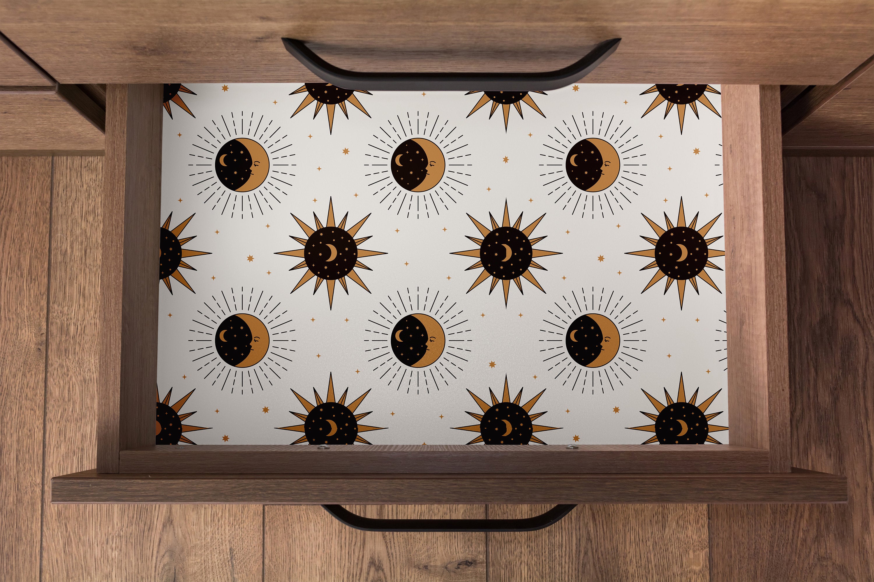 Contact paper 1558: Sun and moon patterned contact paper with golden celestial symbols, styled in a wooden drawer for a cosmic, modern-boho vibe.