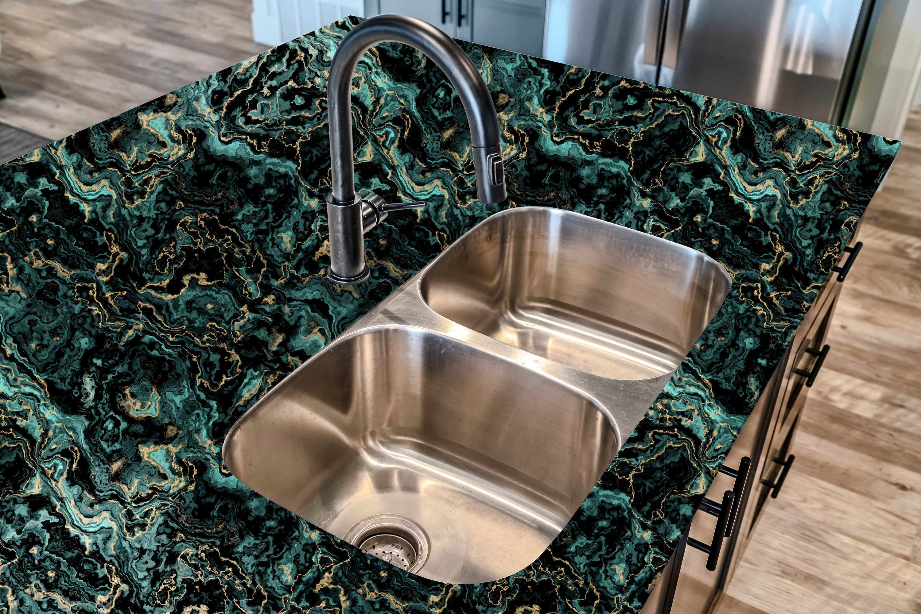 Countertop 36: A kitchen countertop covered in a striking dark green and gold marble-patterned film, featuring a bold swirling stone texture for a high-end and luxurious aesthetic.
