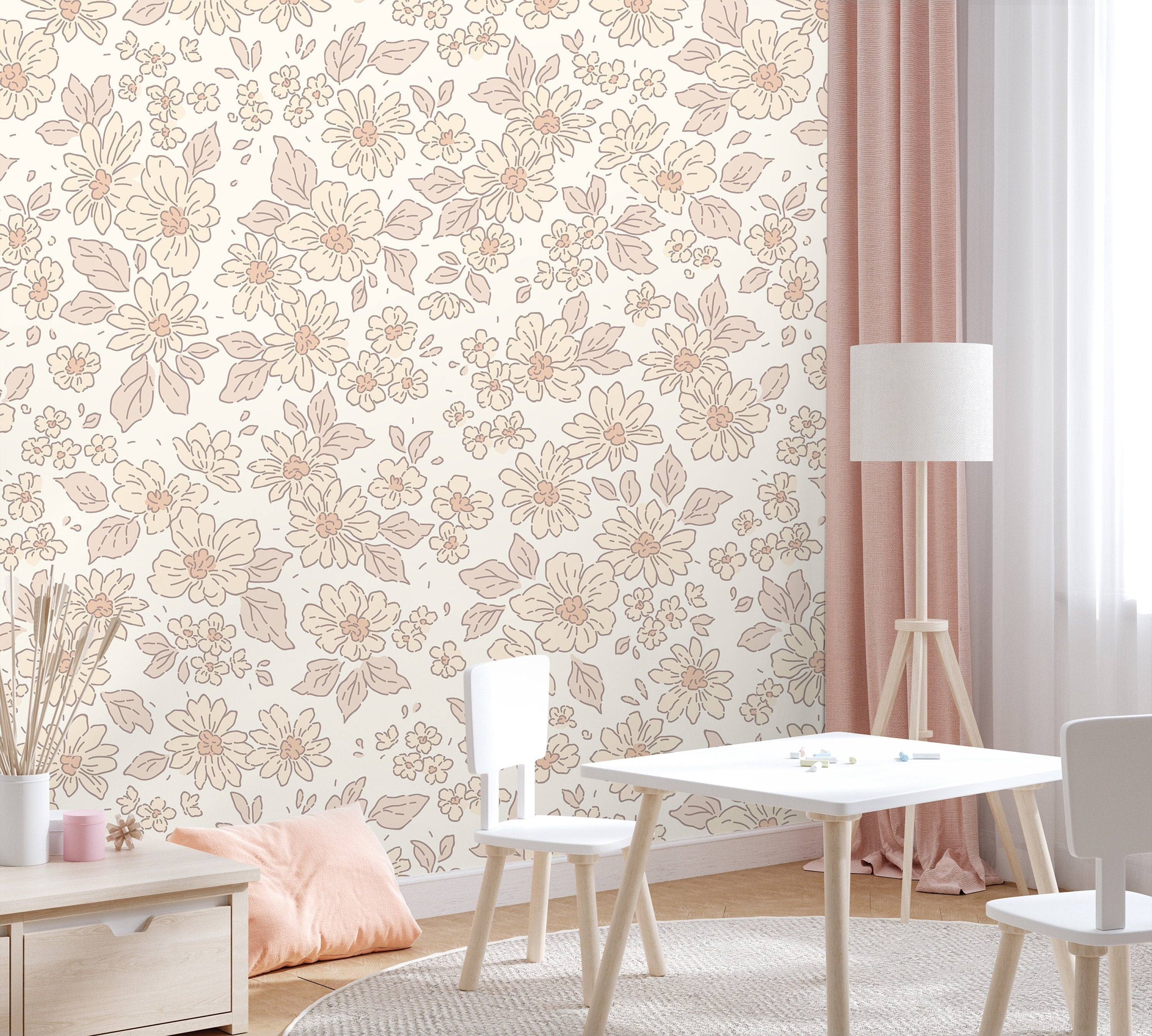 Wallpaper 833: Soft blush pink floral wallpaper with hand-drawn daisies and leaves in a pastel playroom, styled with light wood furniture, white chairs, and pink accents.