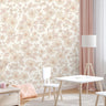 Wallpaper 833: Soft blush pink floral wallpaper with hand-drawn daisies and leaves in a pastel playroom, styled with light wood furniture, white chairs, and pink accents.