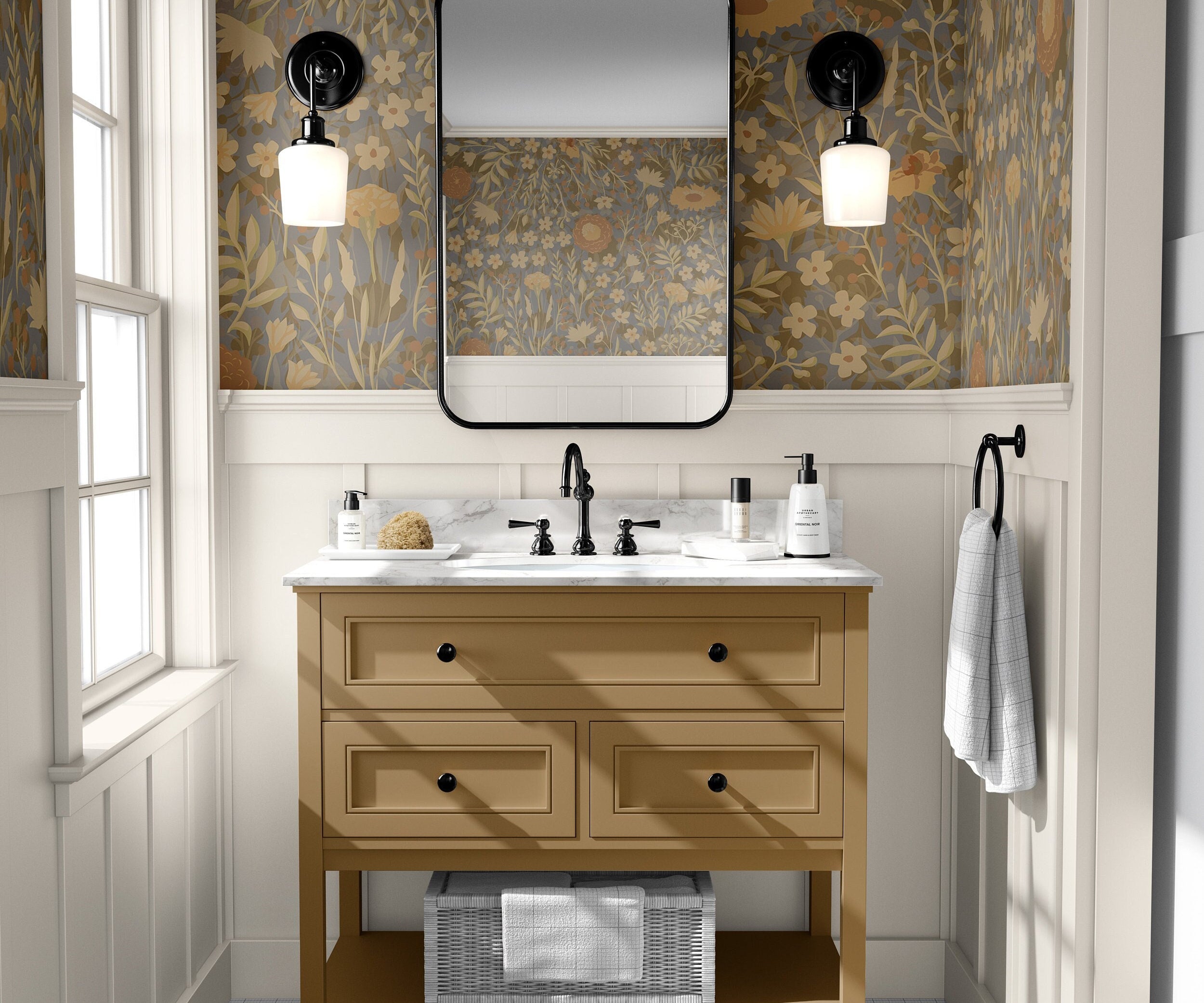 Wallpaper 775: Elegant bathroom featuring moody floral wallpaper in warm tones of mustard, olive, dusty blue, and ochre, styled with white wainscoting and a golden vanity with black fixtures.