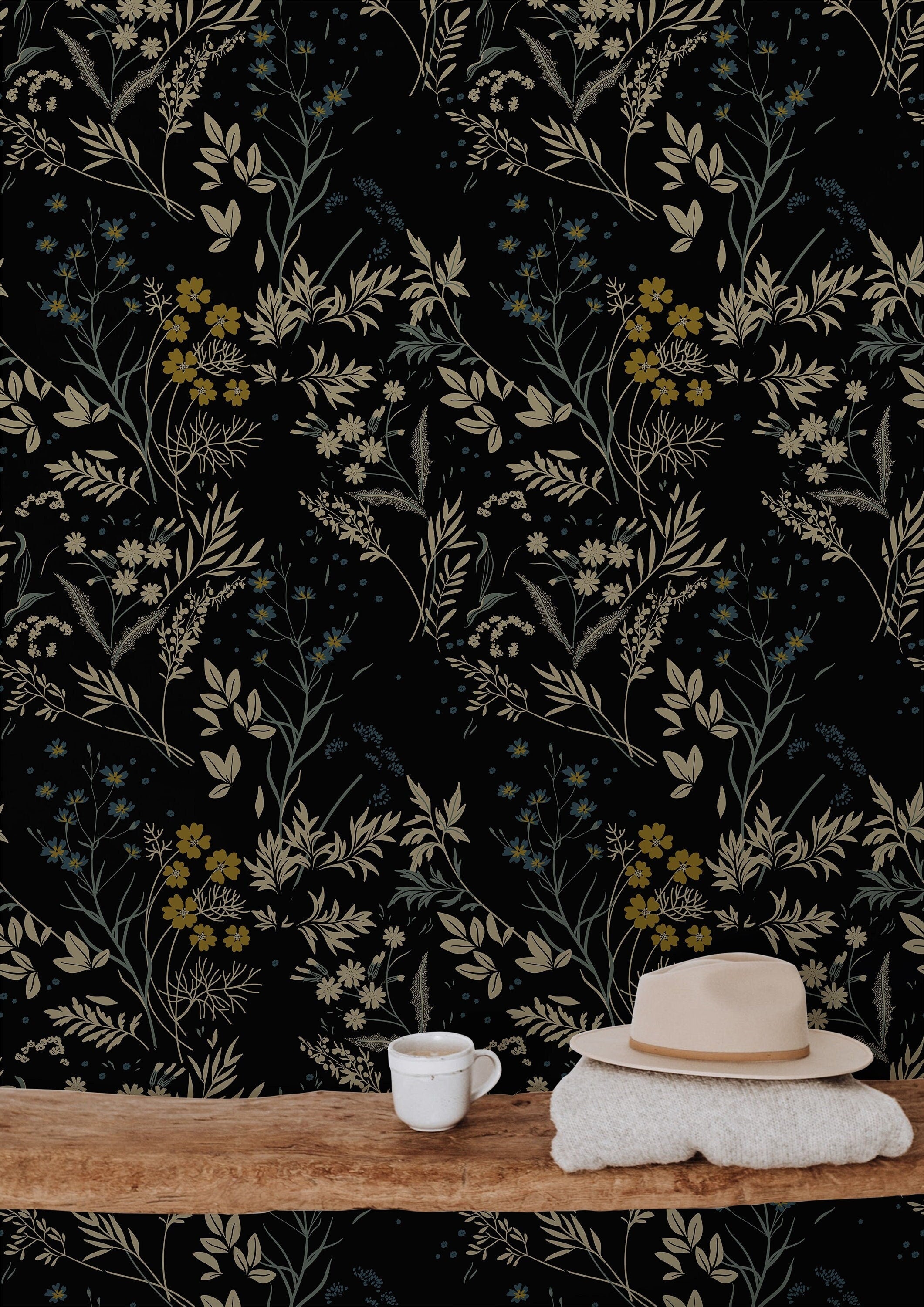 Wallpaper 860: A sophisticated dark floral wallpaper featuring beige, gold, and muted blue wildflowers on a deep black background. The vintage botanical design adds a moody yet elegant touch to modern and cottagecore interiors.