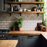 Wallpaper 1097:  A modern kitchen featuring a geometric-patterned backsplash in black and beige. The design adds a stylish, contemporary touch to the space, complemented by wooden countertops, gray cabinetry, and potted greenery.